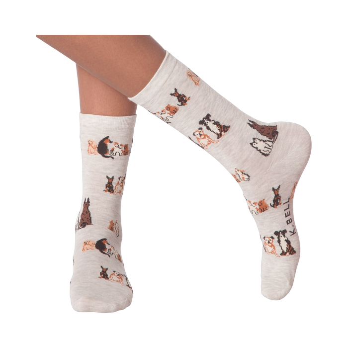 Lifestyle shot of woman's legs wearing the grey crew socks with the dog pattern.