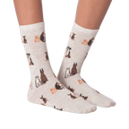 Close-up studio shot of a pair of the grey crew socks; showcasing the dog pattern.