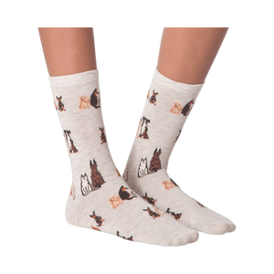 Close-up studio shot of a pair of the grey crew socks; showcasing the dog pattern.