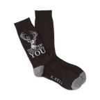 A pair of dark brown crew socks with a white deer graphic and the phrase 'BUCK YOU'. Gray accents at the heel and toe.