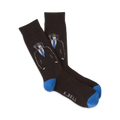 A pair of dark gray crew socks featuring a design of monkeys wearing suits and blue ties. The socks have bright blue cuffs.