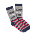 A pair of crew socks in grey, red, and navy blue.  The socks feature horizontal stripes and the text 'Land of the Free'.