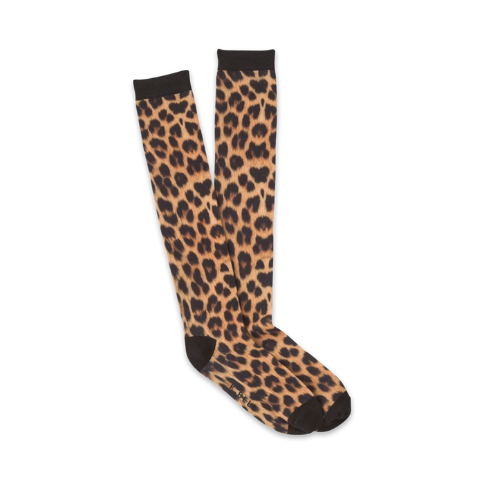 knee-high womens leopard print socks in vibrant orange with black spots.   }}