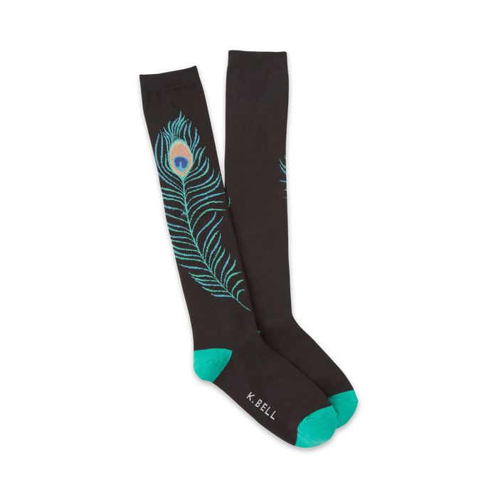 black knee-high peacock feather socks for women have a green band around the top and feature a pattern of blue, green, and brown feathers.    }}