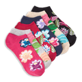 Stack of six ankle socks in bright colors like pink, navy, and black, featuring large botanical floral patterns and leaves.