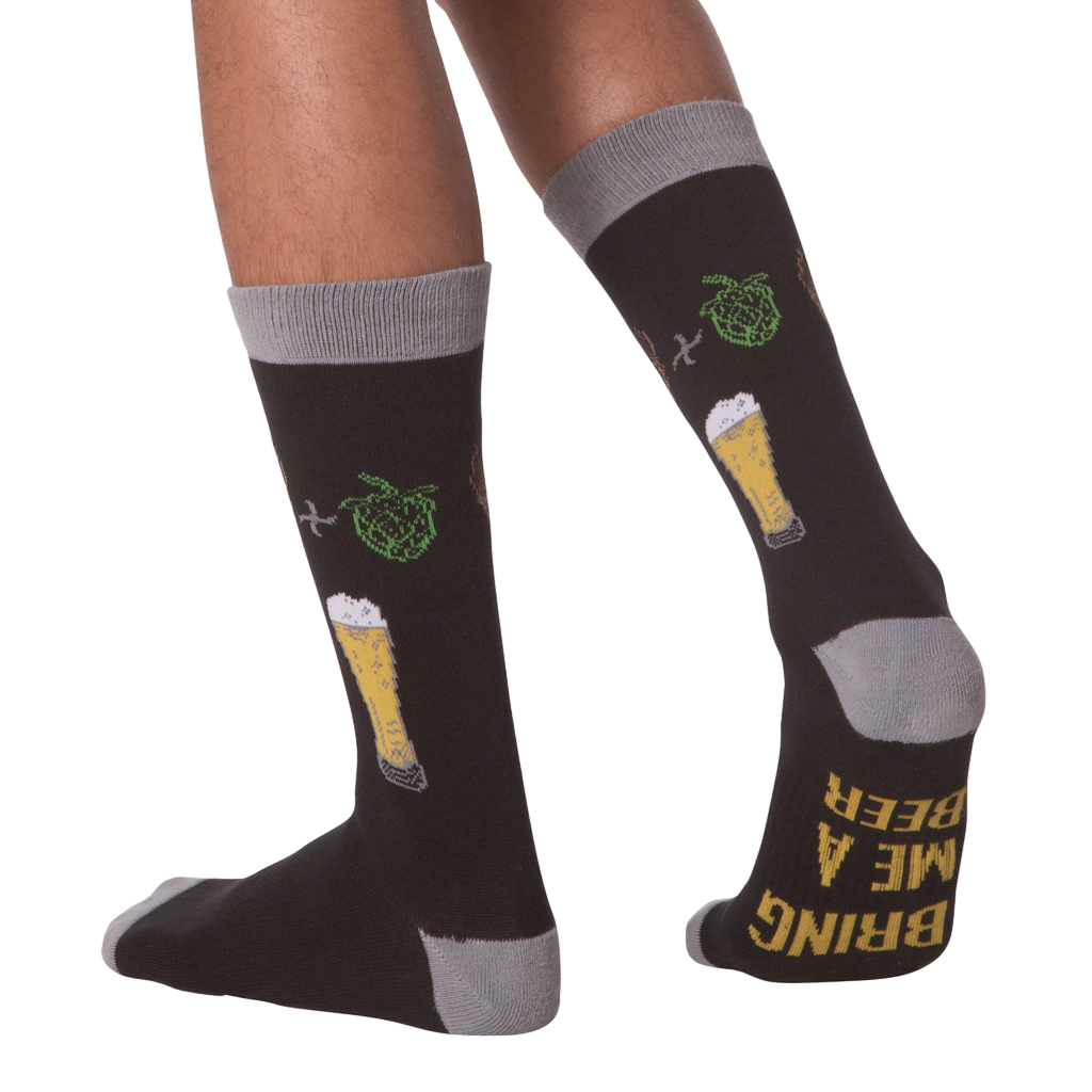 Lifestyle shot of a person wearing the 'Bring Me A Beer' socks, demonstrating fit and style.