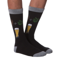 Pair of 'Bring Me A Beer' socks lying flat showcasing the full design, including text on the cuff.