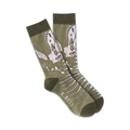 Pair of olive green crew socks with a detailed T-Rex skeleton design in off-white. 