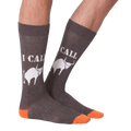 Lifestyle shot of a person's legs wearing the 'I Call Bullshit' socks, showing the fit and style.