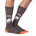 Lifestyle shot of a person's legs wearing the 'I Call Bullshit' socks, showing the fit and style.