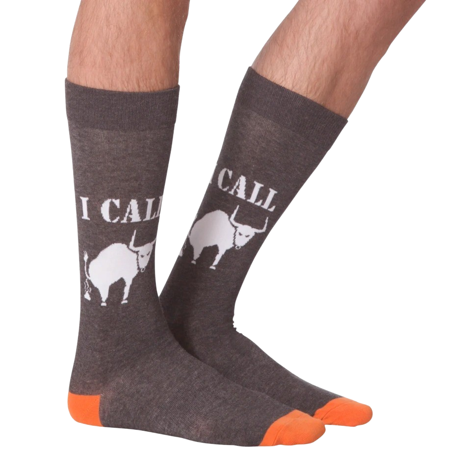Lifestyle shot of a person's legs wearing the 'I Call Bullshit' socks, showing the fit and style.
