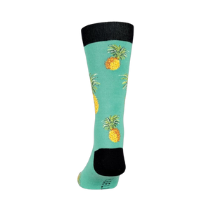 Back view of a teal crew sock with pineapples, showing the design from heel to toe.