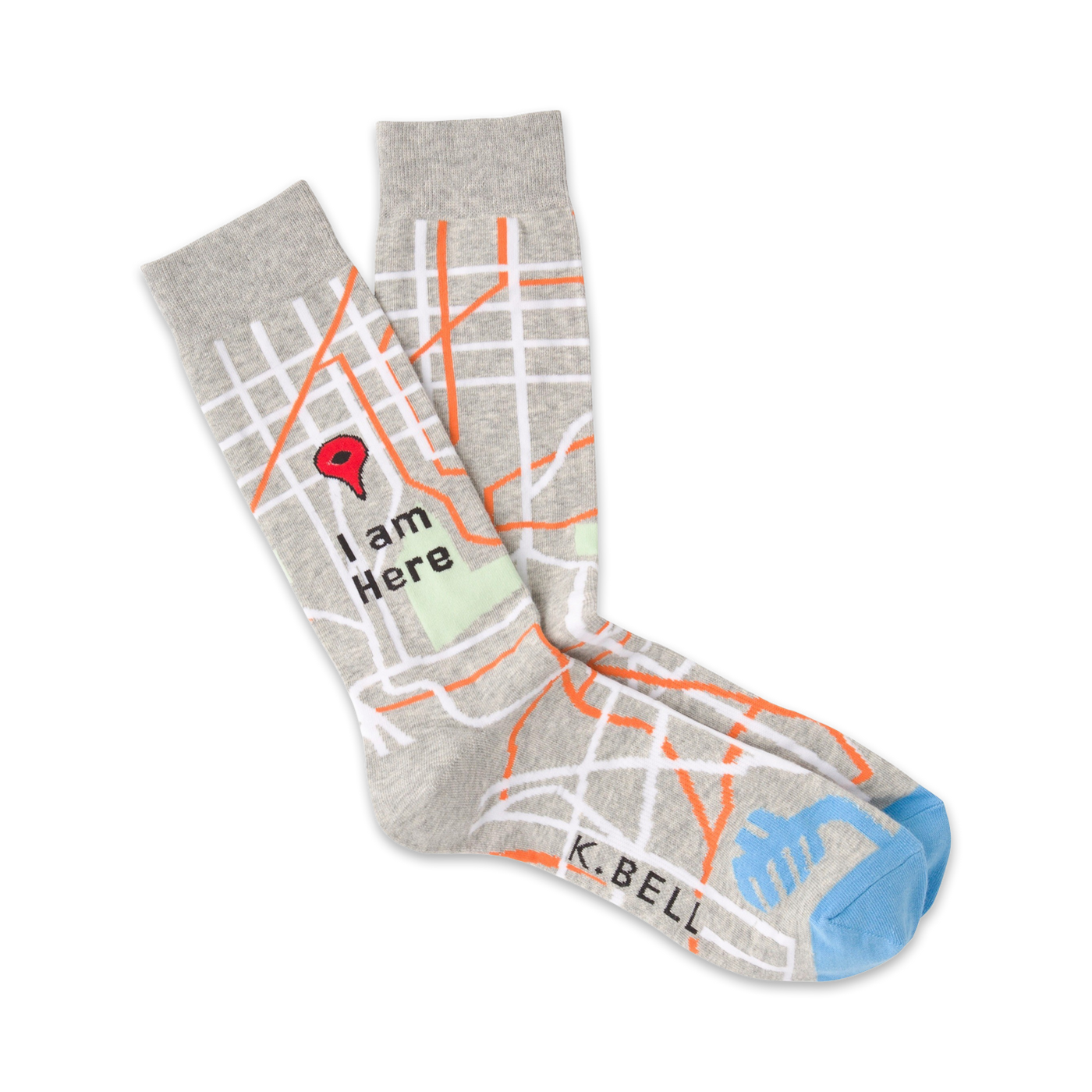 Pair of grey crew socks with a city map design, orange roads, and a red location pin that says 'I am Here'. Light blue heel and toe.