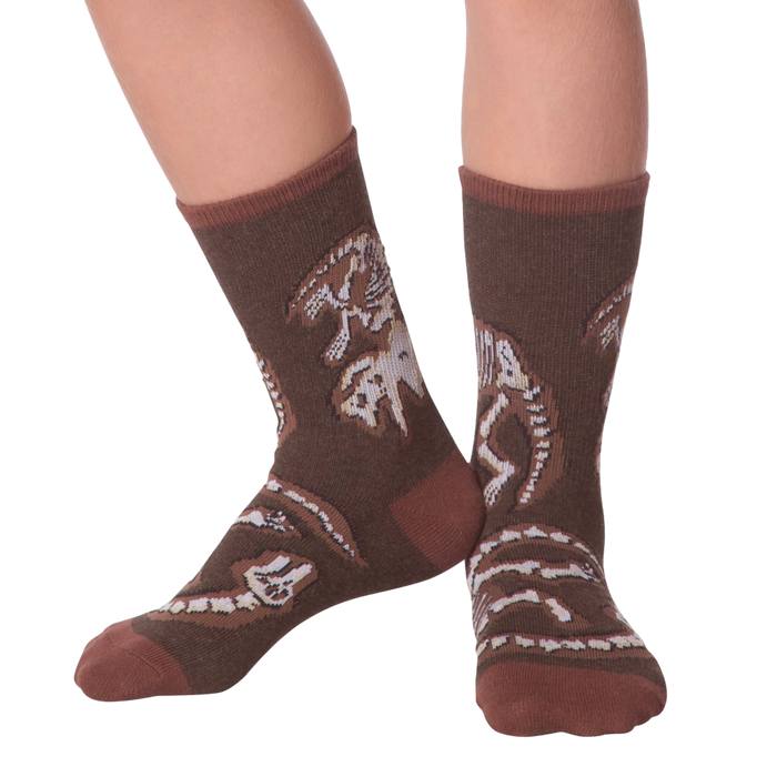 Lifestyle shot of Dino Bones socks on a person's feet.