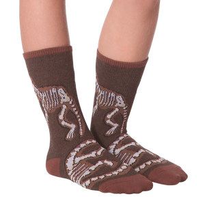 Another lifestyle shot of Dino Bones socks on a person's feet.