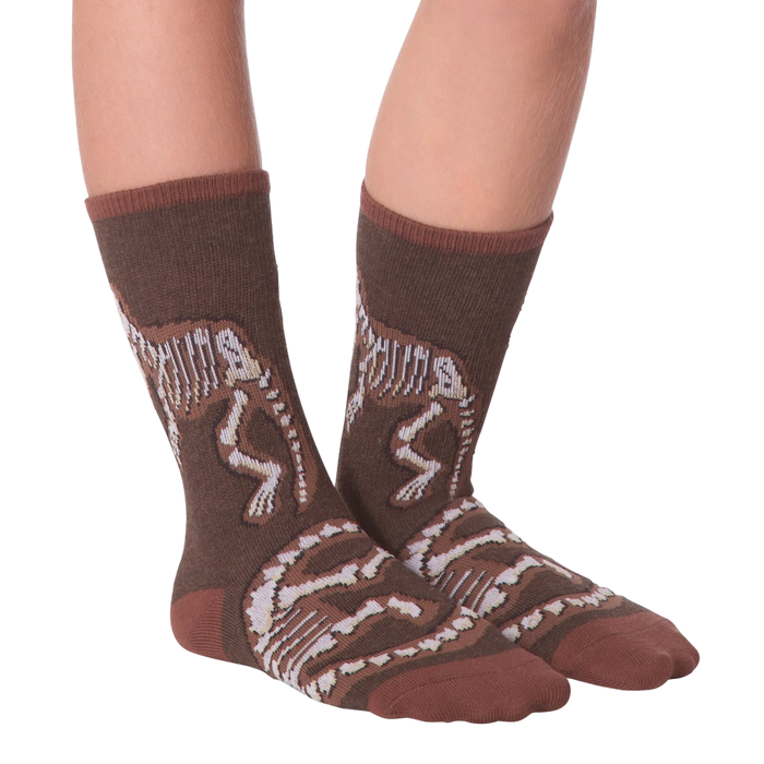 Another lifestyle shot of Dino Bones socks on a person's feet.