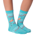 Close-up flatlay of 'I Don't Give a Flock' flamingo socks.