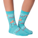 Close-up flatlay of 'I Don't Give a Flock' flamingo socks.