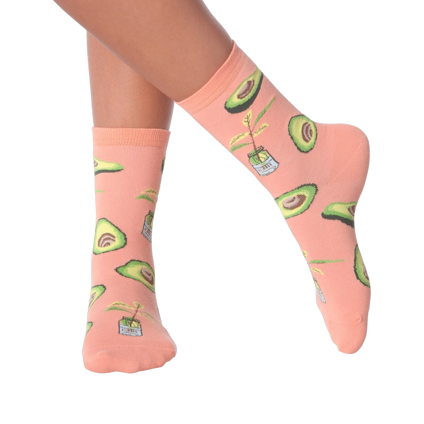 Lifestyle shot of woman's legs wearing peach avocado socks.