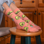 Close-up lifestyle shot of a person wearing the avocado socks. [lf]