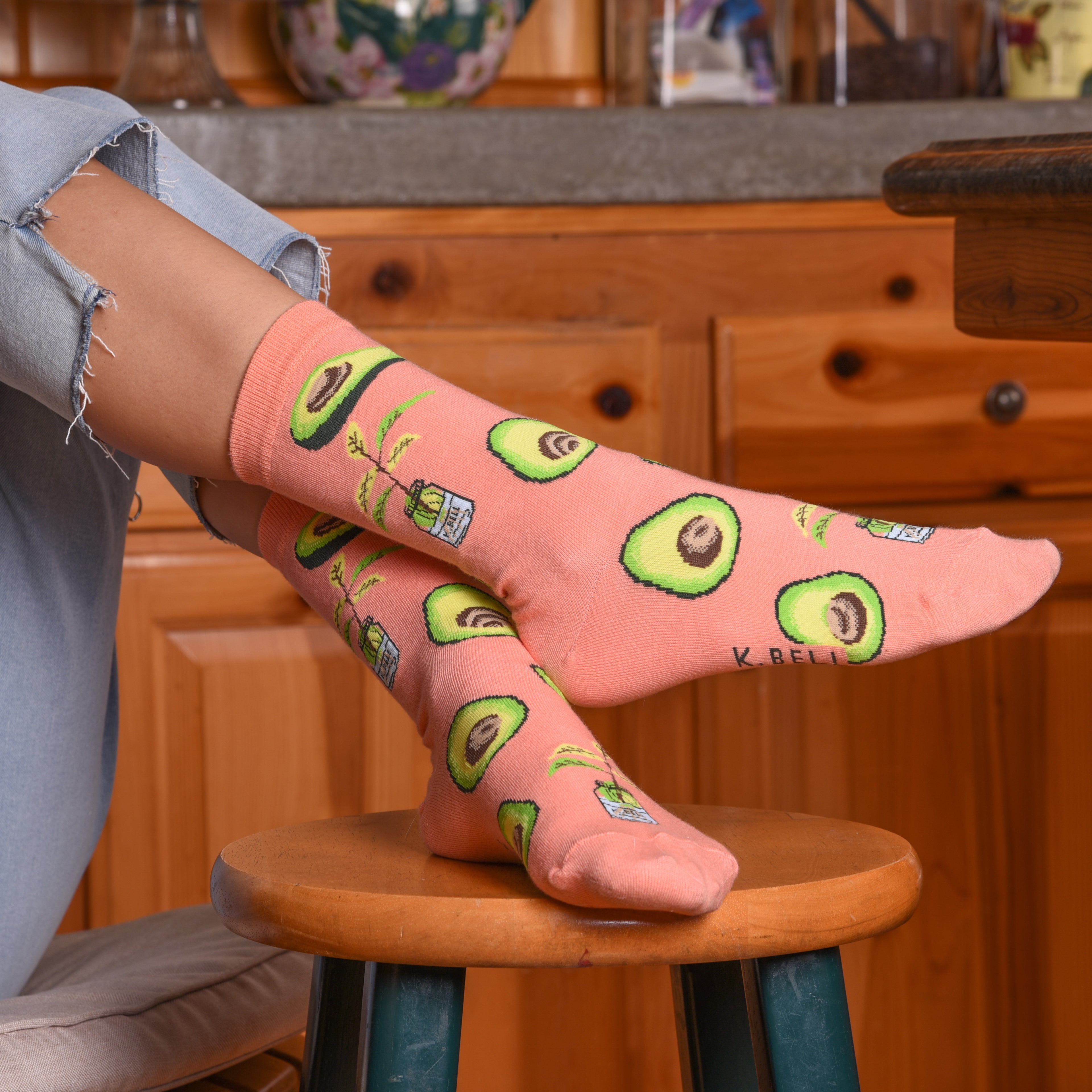 Close-up lifestyle shot of a person wearing the avocado socks, slightly different angle. [lf]