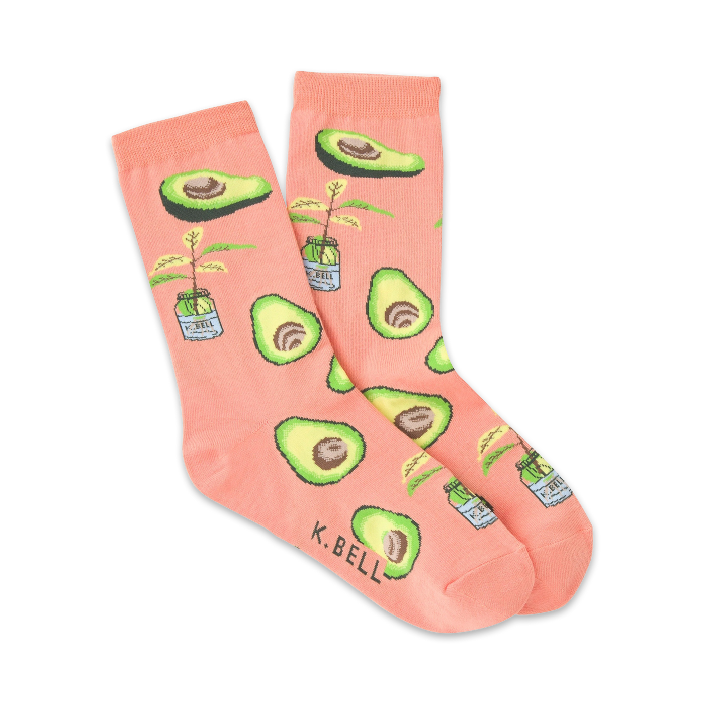 Pair of peach-colored crew socks with illustrated avocados and small potted avocado plants. 