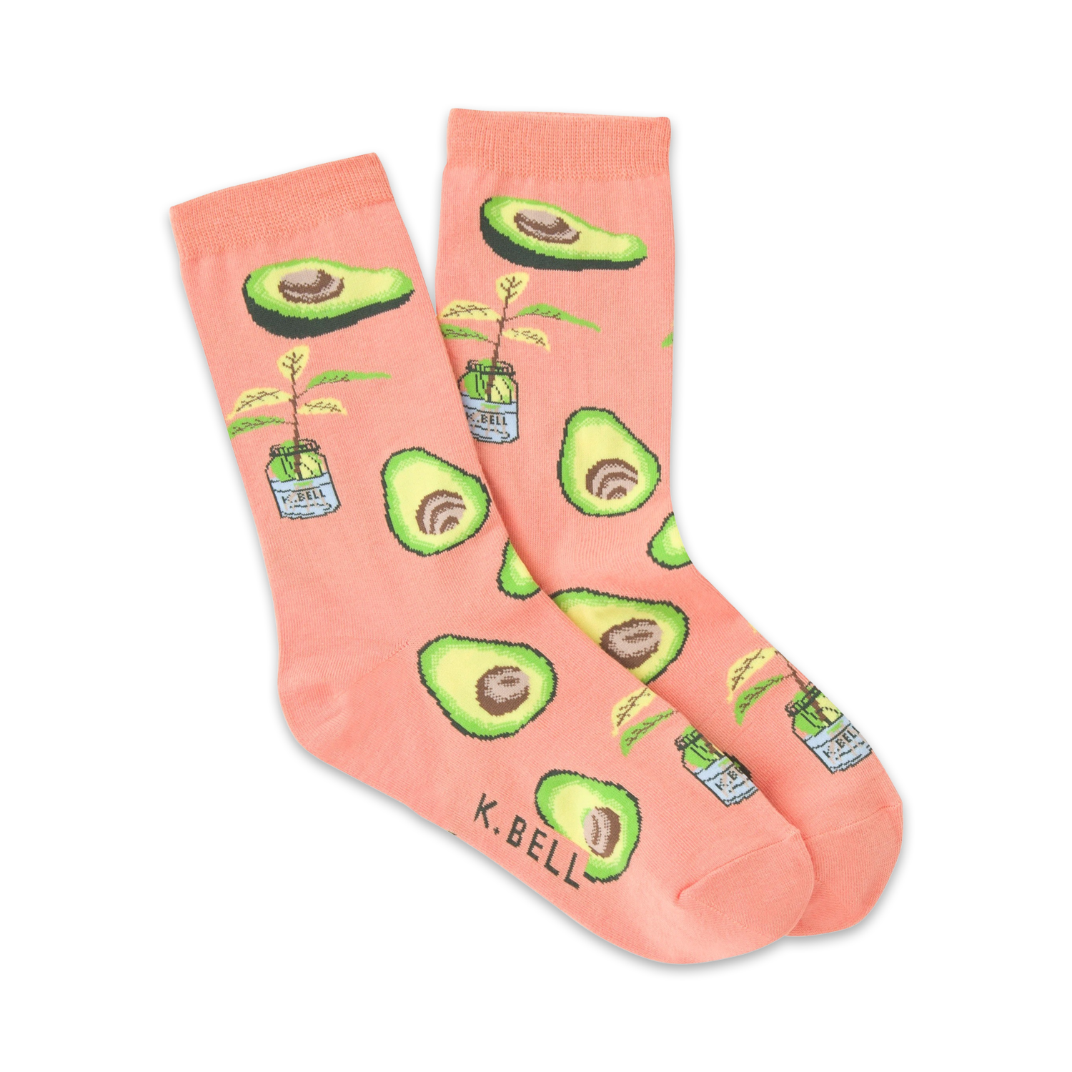 Pair of peach-colored crew socks with illustrated avocados and small potted avocado plants. 