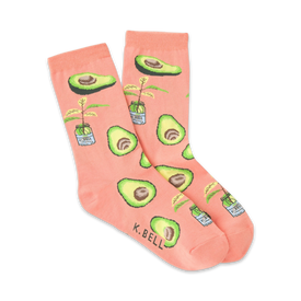 light pink women's crew socks feature a fun avocado print with brown stems and pits.   