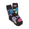 A pair of crew socks in black with a fun print of colorful hummingbirds and hibiscus flowers. 