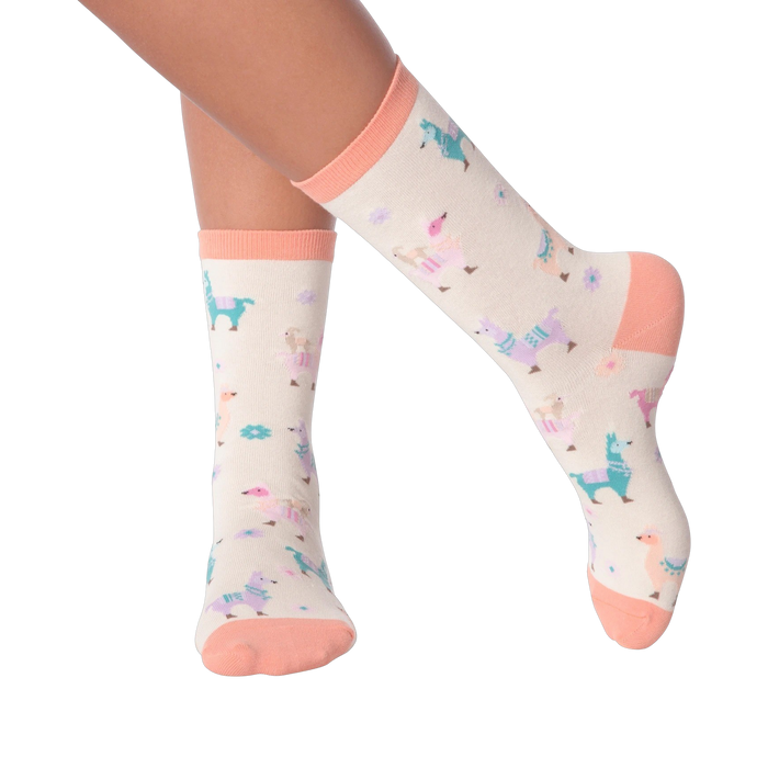 Lifestyle shot showing a person's legs wearing the pastel llama socks.