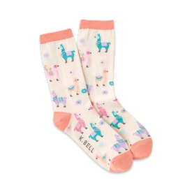 pink crew socks featuring a pattern of multicolored llamas wearing saddles and floral arrangements on a cream-colored background.   