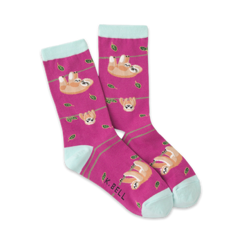 pink crew socks with a pattern of sloths hanging from green branches with dark green leaves. fun and funky socks for women.  
