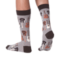 Lifestyle shot of a person wearing the guitar socks, showcasing how they look on feet.