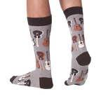 Lifestyle shot of a person wearing the guitar socks, showcasing how they look on feet.