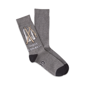 gray crew socks with black toes and heels featuring a cowbell with drumsticks and the words 'more cowbell' written vertically.   