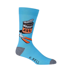 Close-up of a single blue 'Whoop Ass' sock on a black background, showing detail of the design.