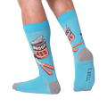 A person's legs wearing the 'Whoop Ass' socks. Shows the socks on feet.
