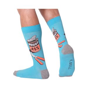 A person's legs wearing the 'Whoop Ass' socks. Shows the socks on feet.