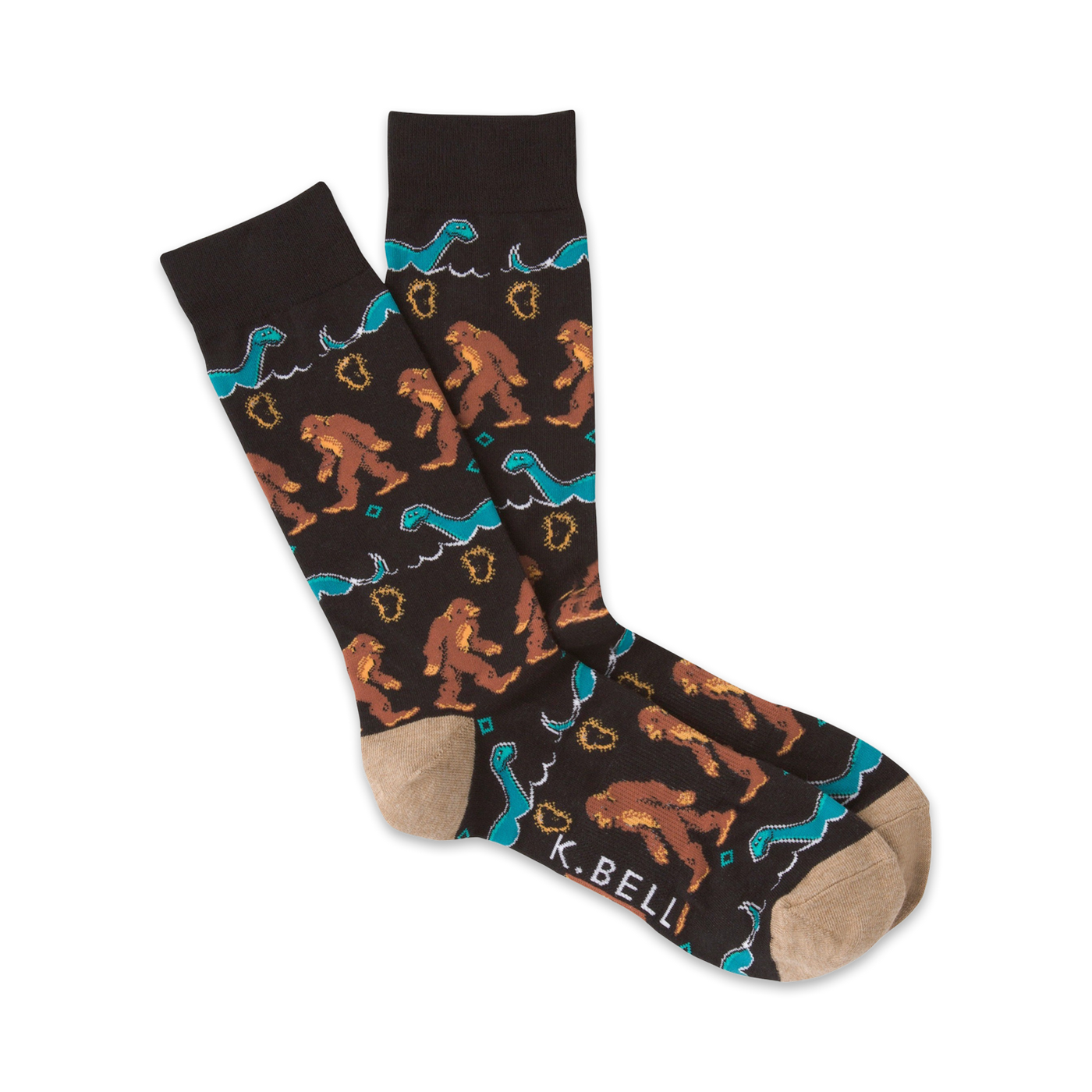 A pair of brown crew socks with a pattern of Bigfoot and the Loch Ness Monster in teal and brown.  The socks have a tan toe and heel.
