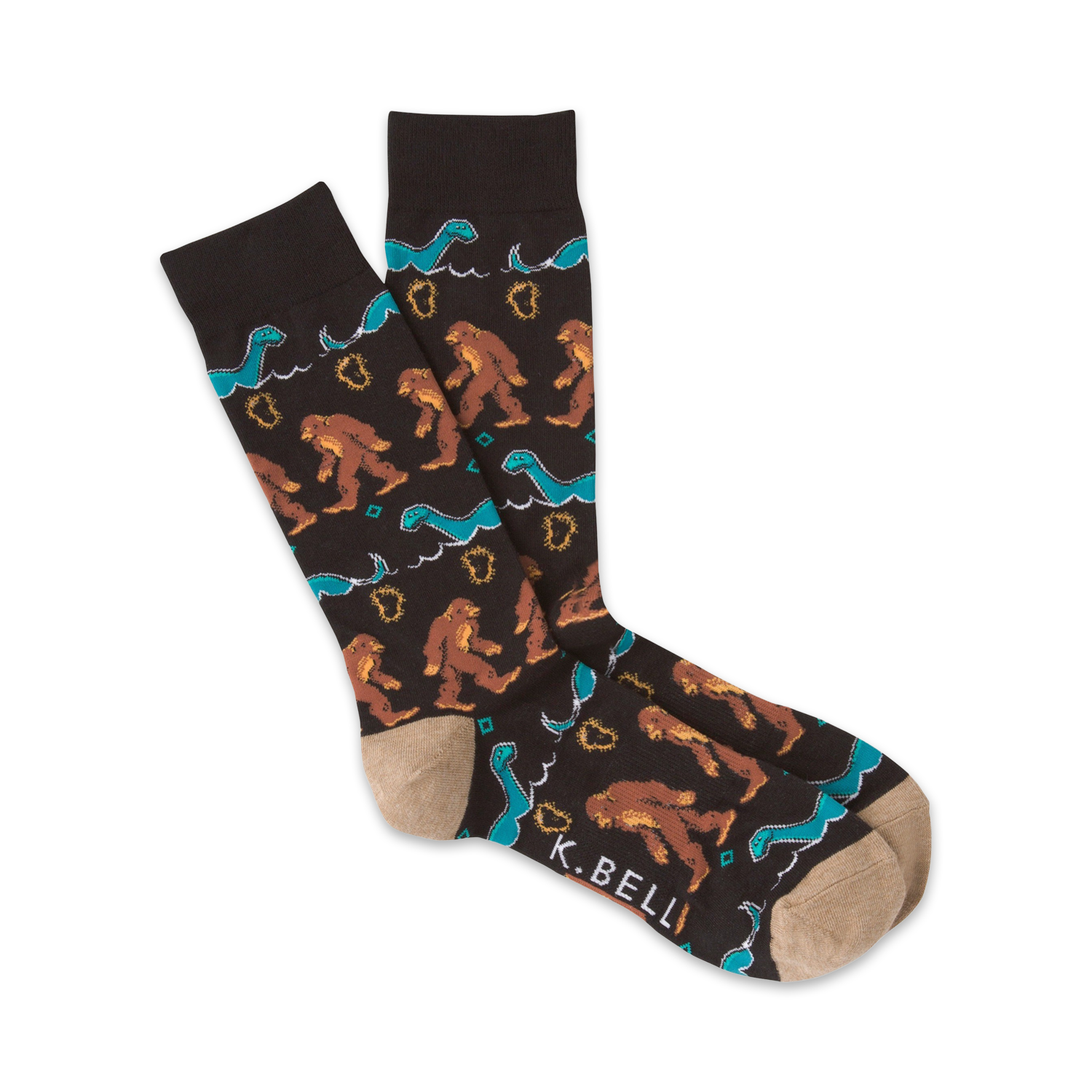 A pair of brown crew socks with a pattern of Bigfoot and the Loch Ness Monster in teal and brown.  The socks have a tan toe and heel.