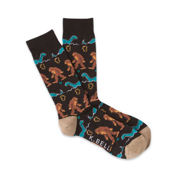 mens brown crew socks with a pattern of blue loch ness monsters and brown bigfoot creatures.  