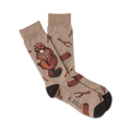 A pair of tan crew socks with a brown beaver holding a 'Dam It!' sign and wood log illustrations.  Darker brown accents at the cuffs.
