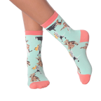 Lifestyle shot of a person wearing the Musical Dogs socks, showcasing how they look on the feet.