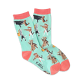Crew socks in mint green with coral cuffs.  The design features various breeds of dogs playing musical instruments like the piano, cello, and saxophone.