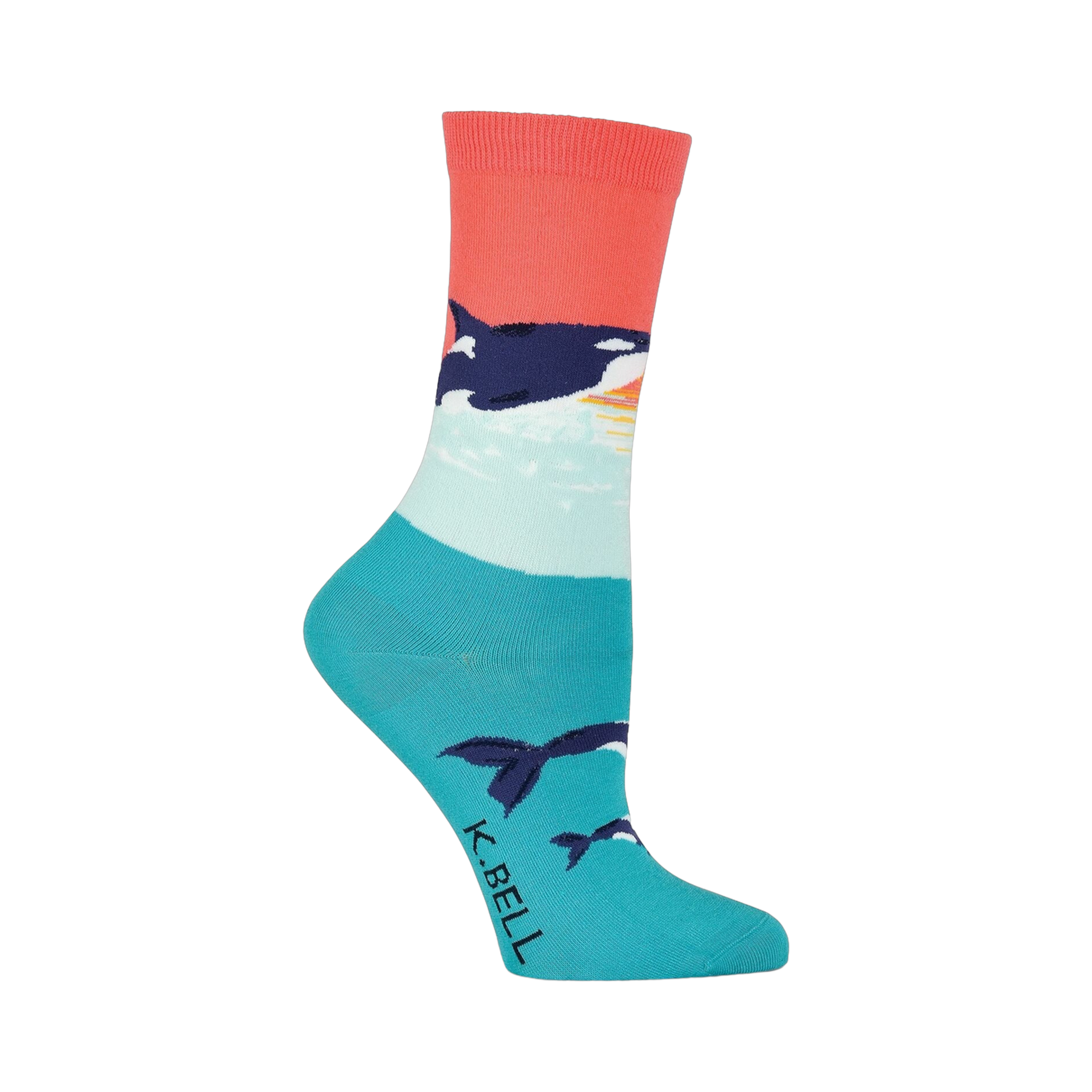 Crew socks in coral, teal, and white featuring an orca whale design against a sunset backdrop. Orcas are also shown swimming near the bottom of the sock.