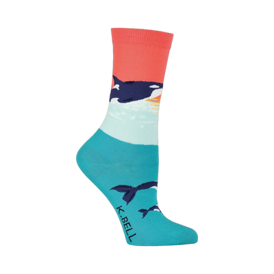 Crew socks in coral, teal, and white featuring an orca whale design against a sunset backdrop. Orcas are also shown swimming near the bottom of the sock.