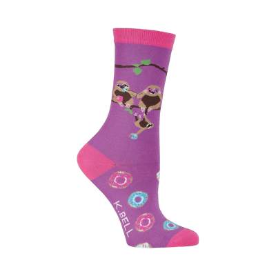 Purple crew socks with pink accents.  The design includes three sloths hanging on a branch and scattered donuts.