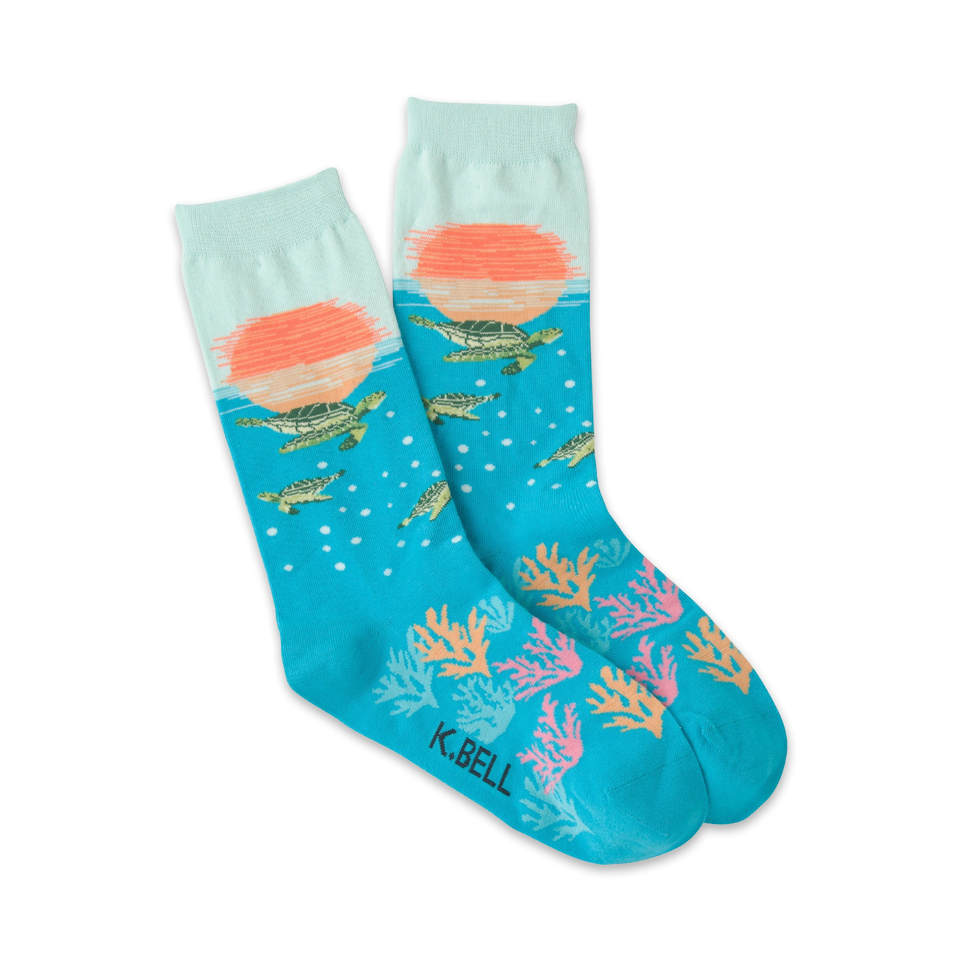 Pair of teal crew socks. Features a sunset scene, sea turtles swimming, coral, and bubbles. 