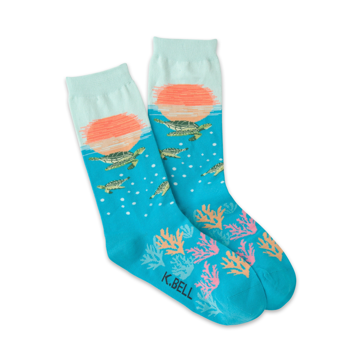 Pair of teal crew socks. Features a sunset scene, sea turtles swimming, coral, and bubbles. 