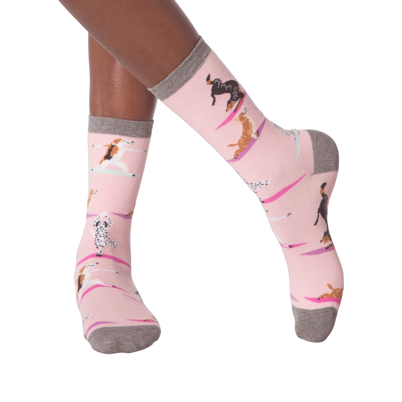 Lifestyle shot of woman's legs wearing Yoga Dogs socks and black sneakers.